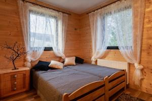 Postel nebo postele na pokoji v ubytování PUSTELNIA WODZA