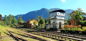 a group of train tracks next to a train station at Kithul Cottage in Nuwara Eliya