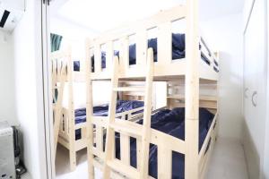 Postel nebo postele na pokoji v ubytování 札幌市にある１０人宿泊可能物件
