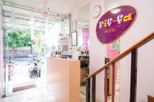 a store with a sign for a hotel at Urbanview Hotel FiFFa Kauman Malang in Malang