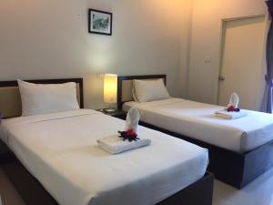 Postel nebo postele na pokoji v ubytování Ben Guesthouse