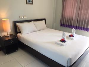 Postel nebo postele na pokoji v ubytování Ben Guesthouse