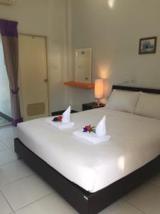 Postel nebo postele na pokoji v ubytování Ben Guesthouse