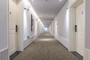 Mynd úr myndasafni af 银座精宿酒店 - 济南泺源大街泉城广场宽厚里店 í Jinan