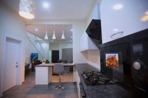 Kuchyň nebo kuchyňský kout v ubytování Maple Homes