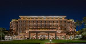 a large building with an arch in front of it at Mayfield Hotel Seoul in Seoul
