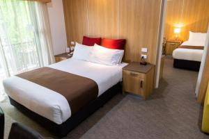 מיטה או מיטות בחדר ב-Albury Regent Motel