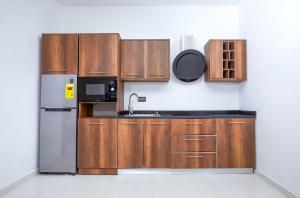 Kuchyň nebo kuchyňský kout v ubytování Maple Homes