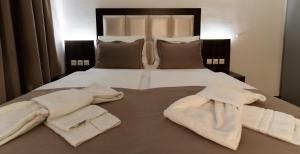 Postel nebo postele na pokoji v ubytování Hotel Myrsini