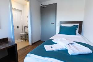 Postel nebo postele na pokoji v ubytování Hotel Myrsini