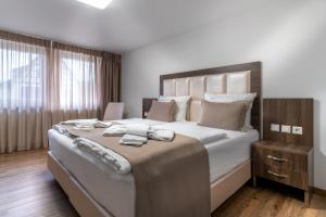 Postel nebo postele na pokoji v ubytování Hotel Myrsini