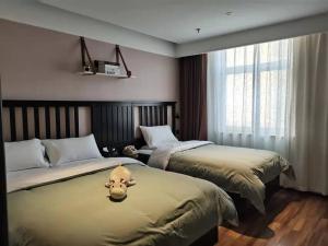 Fotografie z fotogalerie ubytování 银座精宿菏泽中华路银座商城火车站店 v destinaci Heze + 18 fotografií