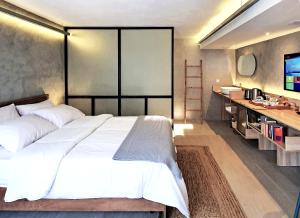 Voodi või voodid majutusasutuse Dodo Studio 1 I Your luxury cosy retreat home toas