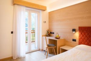 Postel nebo postele na pokoji v ubytování Hotel Zurigo