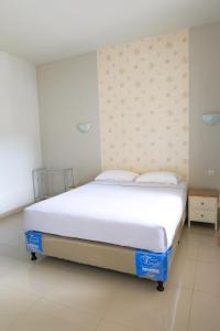 Postel nebo postele na pokoji v ubytování Rosetta Homestay