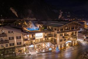 a city at night with lots of buildings at Hotel Neue Post in Mayrhofen