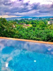 a swimming pool with a view of a city at Aonang Phu Dahla Private Pool & Sea View - SHA Plus in Ao Nang Beach