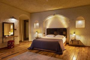 a bedroom with a large bed in a room at Seki Cave Hotel, Wake Up to Hot Air Balloons in Göreme +78 photos