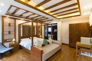 Postel nebo postele na pokoji v ubytování Lijiang Gemmer Hotel