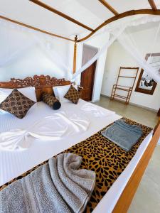 a bedroom with a bed with a leopard print blanket at Top Secret Beach Hotel in Matara +74 photos