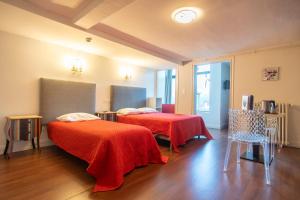 Postel nebo postele na pokoji v ubytování Hôtel Itzalpea
