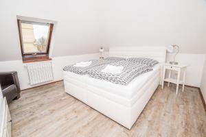 Rúm í herbergi á Hotel Na Baste