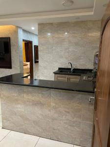 a kitchen with a sink and a counter top at Aqaba Roza in Aqaba
