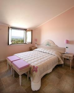 Postel nebo postele na pokoji v ubytování Appartamenti Poggio Fiorito