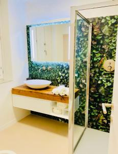 a bathroom with a sink and a mirror at Nima Oberdan House in Perugia +33 photos