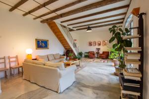 a living room with a couch and a table at Domaine Maison Dodo in Lamonzie-Saint-Martin