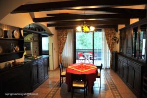 a kitchen with a table and a dining room at B&B CasaMariaSofia in Taranto