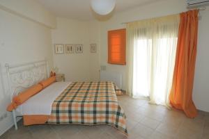 Кровать или кровати в номере Erofili Villas