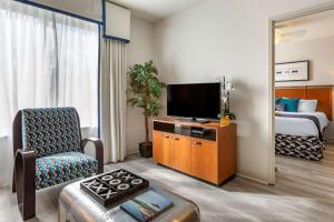 a hotel room with a television and a bed at Bluegreen Vacations Club 36 in Las Vegas