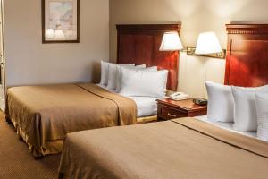 Postel nebo postele na pokoji v ubytování Quality Inn & Suites Fife Seattle