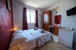 Postel nebo postele na pokoji v ubytování Maxpensione