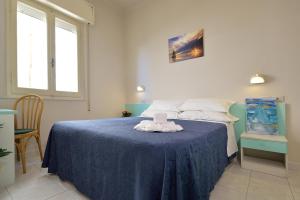 Postel nebo postele na pokoji v ubytování Hotel Oltremar B&B