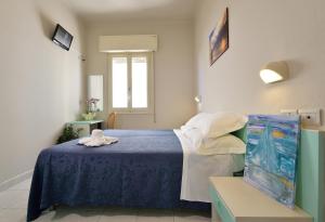 Postel nebo postele na pokoji v ubytování Hotel Oltremar B&B