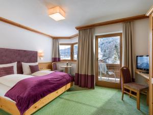 Postel nebo postele na pokoji v ubytování Appartements Alpenschlössl