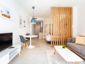 Televízia a/alebo spoločenská miestnosť v ubytovaní WintowinRentals Apartamento sostoa 156