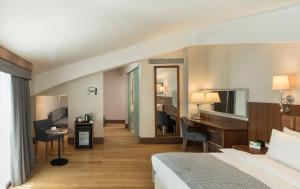 a hotel room with a bed and a desk at Holiday Inn Istanbul Old City by IHG in Istanbul +37 photos