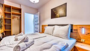Posteľ alebo postele v izbe v ubytovaní Apartament Przy Wyciągu 1 - 5D Apartamenty