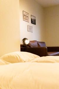 Llit o llits en una habitació de Roomie Alps Design Hostel