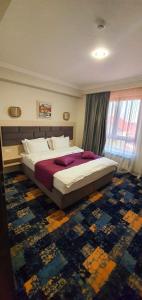 Postel nebo postele na pokoji v ubytování Hotel Yarus Plus
