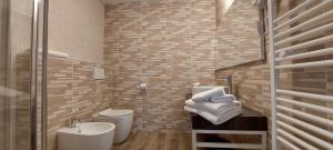 a bathroom with a sink and a toilet and a sink at Locanda della Luna in Ronco Canavese +45 photos