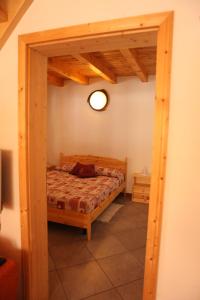 En eller flere senge i et værelse på BAITA ROSA