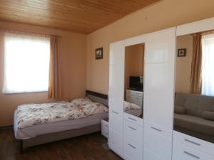 Postel nebo postele na pokoji v ubytování NATURA Vendégházak