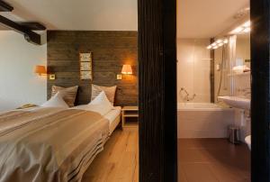 Voodi või voodid majutusasutuse Relais Bayard toas