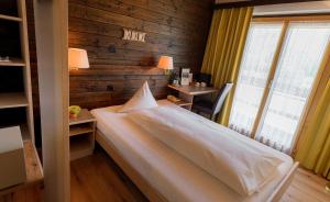 Voodi või voodid majutusasutuse Relais Bayard toas