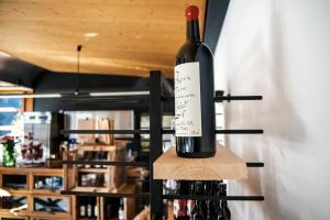 a bottle of wine sitting on a wine rack at Villaggio di vacanza TCS in Quinto