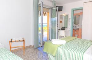 Postel nebo postele na pokoji v ubytování Hotel Caravel B&B